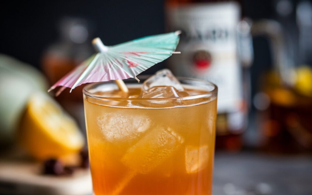 A photo of a cocktail with a rich golden hue. The cocktail is made with homemade Bacardi Rum Vanilla Syrup