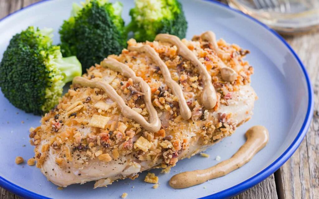 omemade Longhorn Parmesan Crusted Chicken. The chicken breast is coated with a mixture of Parmesan cheese, crushed crackers, and seasonings.